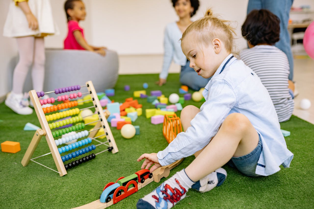 Home Kids enjoying playtime with toys and activities in a vibrant kindergarten setting.